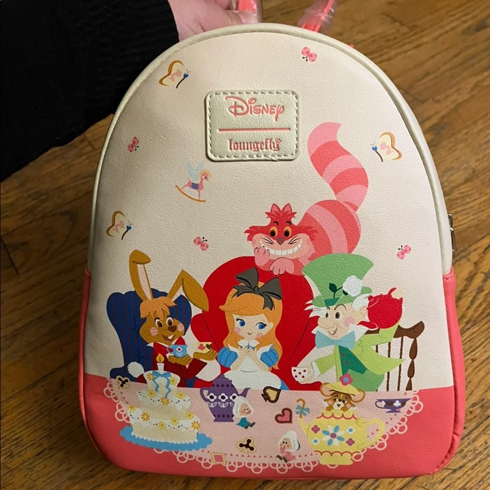 Disney loungefly Alice in wonderland tea party mini backpack.